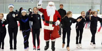 figure skaters with Santa