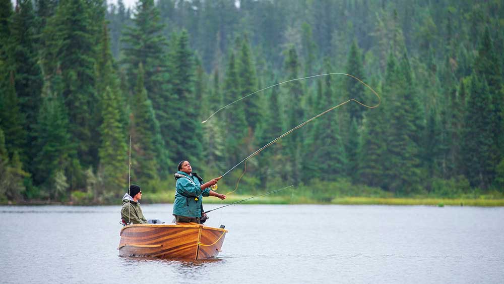 fly anglers in a cedar strip boat