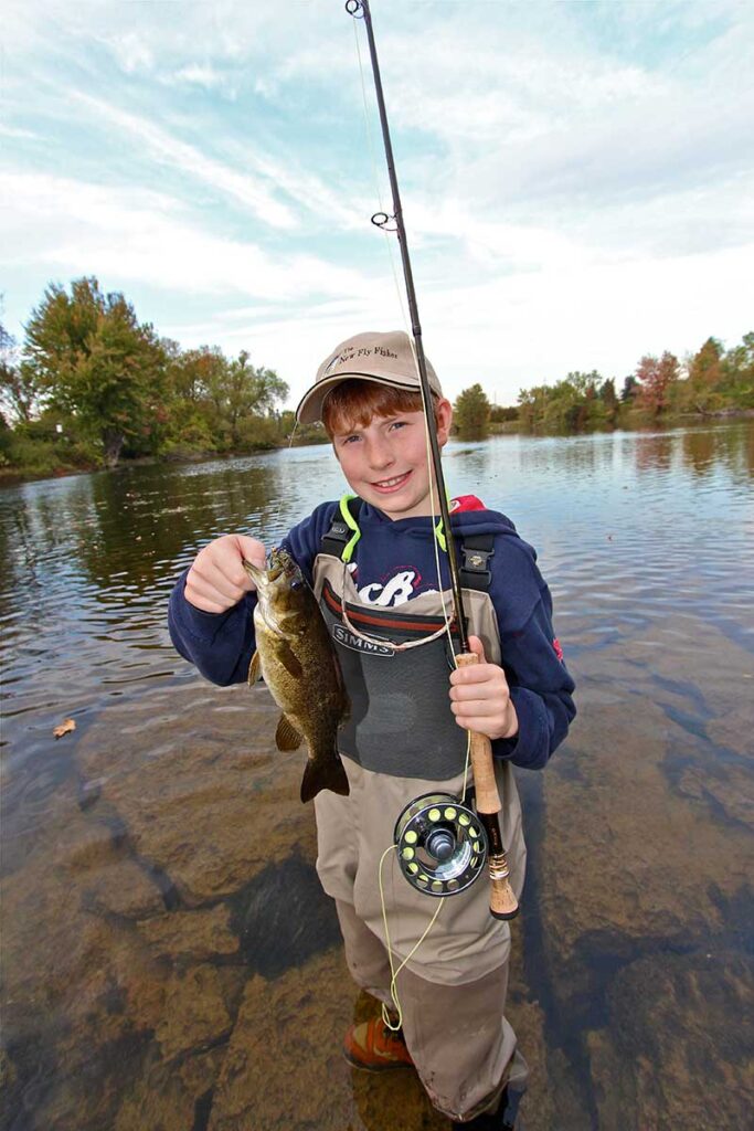 young boy fishing smallmouth bass