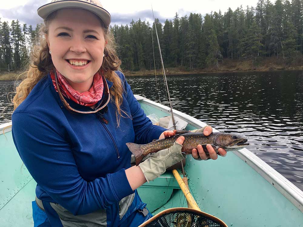 female angler brook trout fishing 