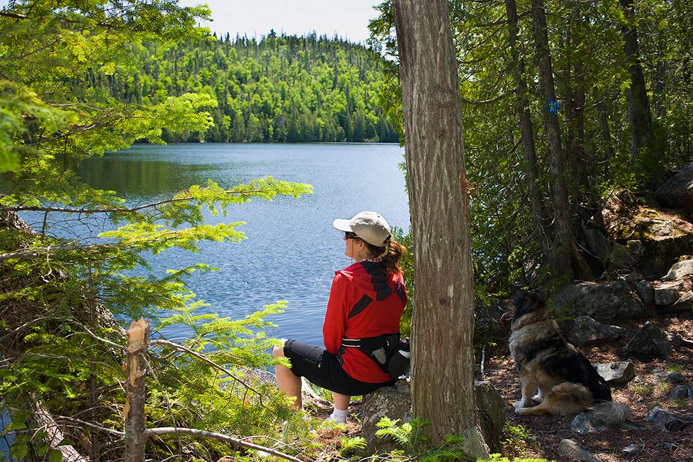 hiker overlooking a lake
