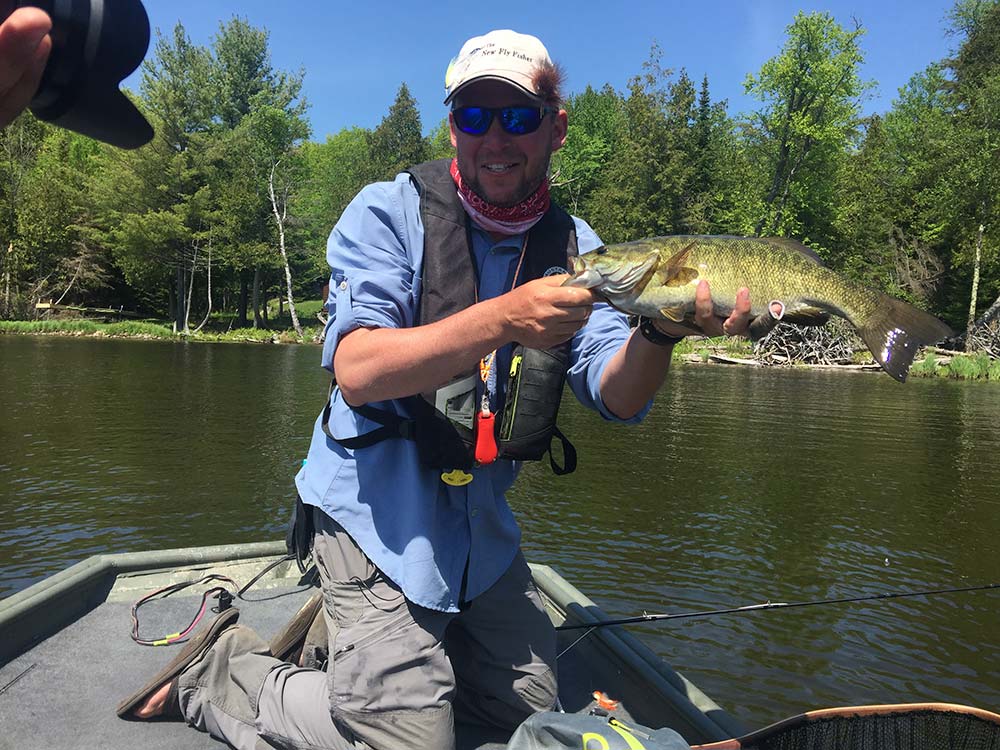 angler smallmouth bass fishing