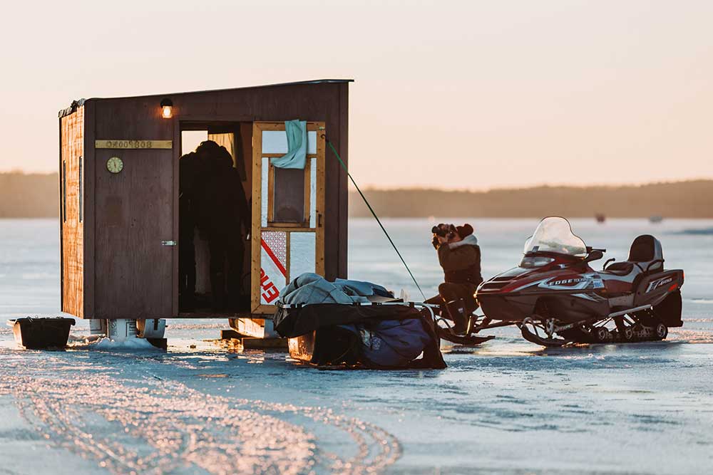 snowmobiling to an ice fishing hut
