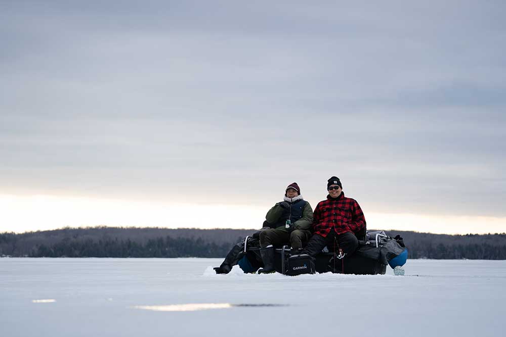 ice anglers sitting on the ice