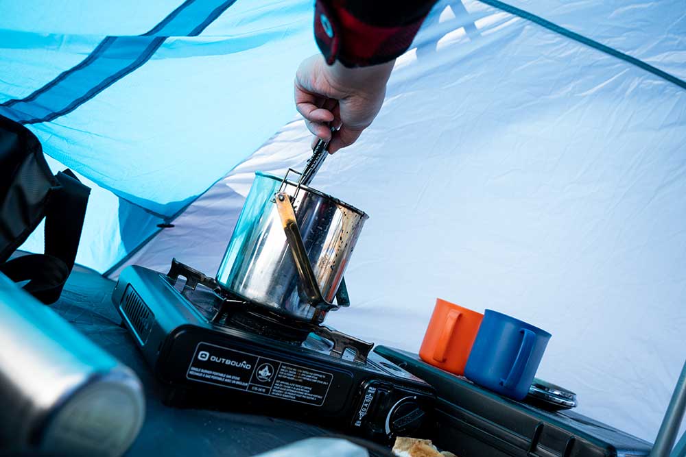 cooking in an ice fishing hut