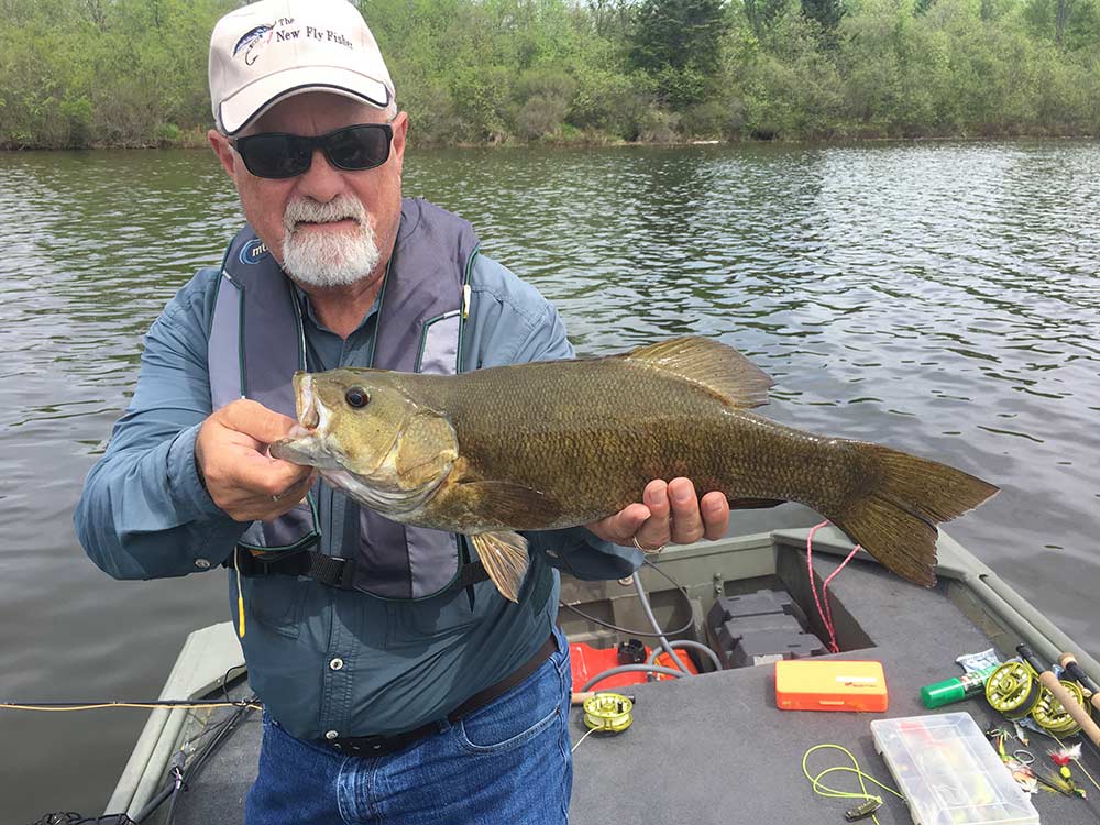 angler fishing smallmouth bass
