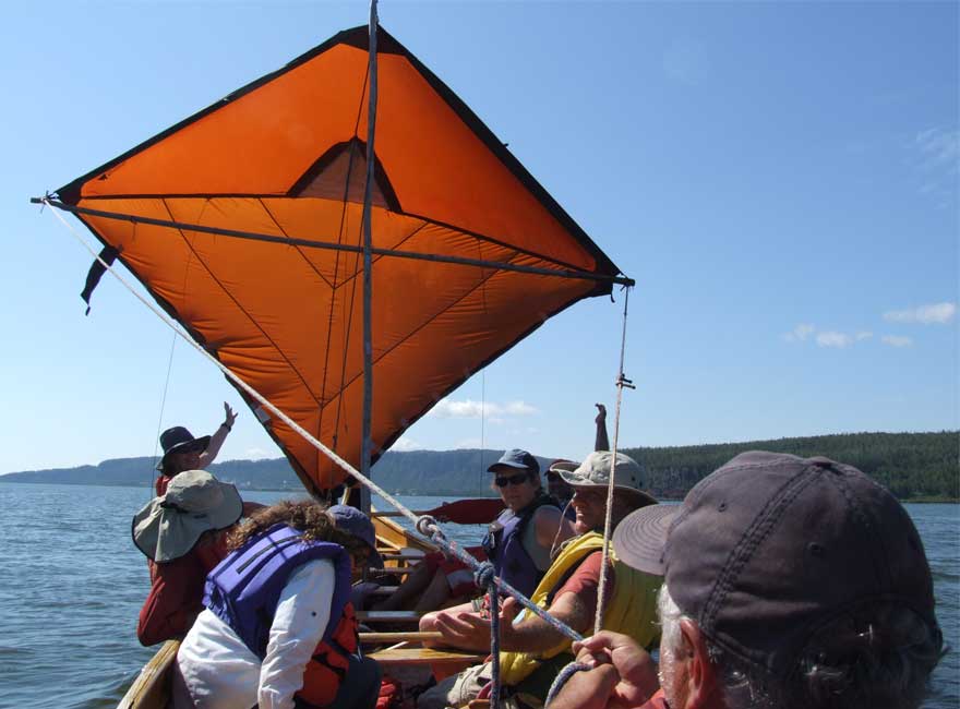 voyageur canoe with sail