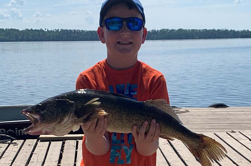child fishing walleye