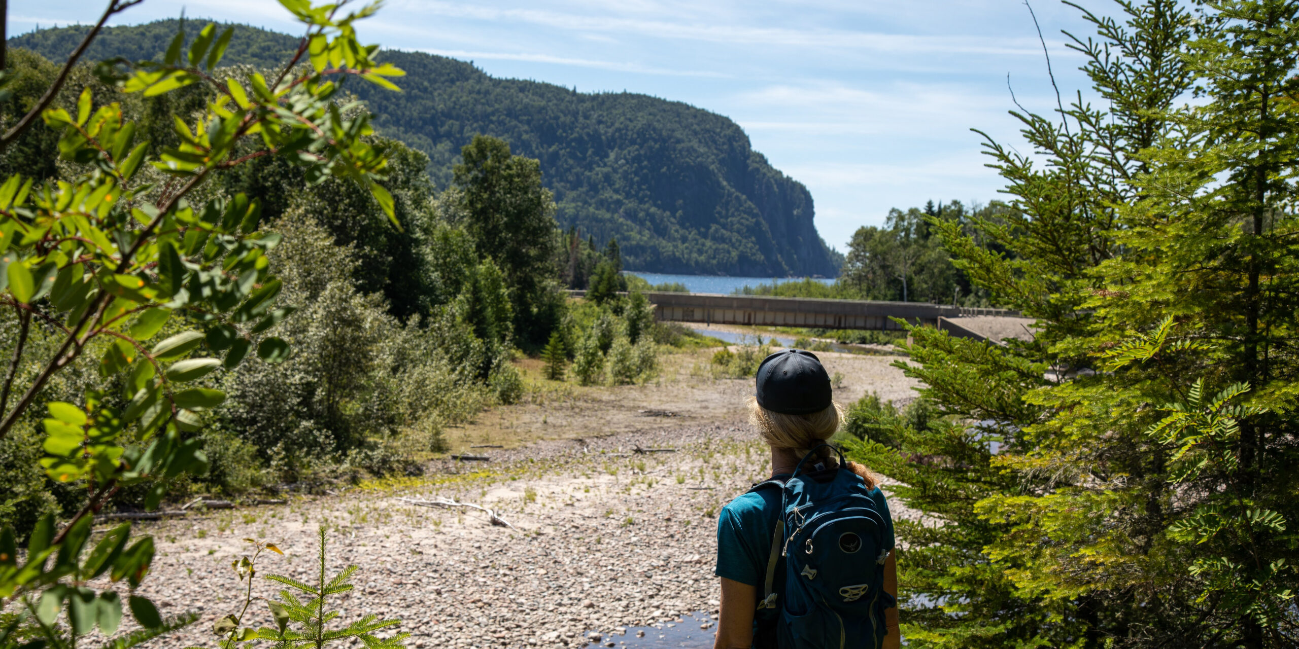 Spring Home Page - Hiker looking at Old Woman Bay