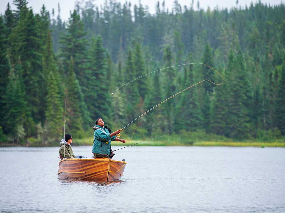 casting from a cedar strip fishing boat